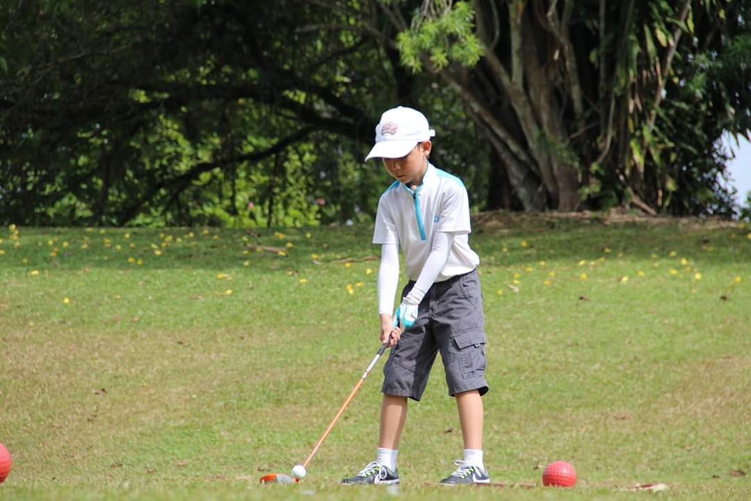 Junior Golfer On Course